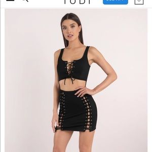 OUT OF YOUR LEAGUE LACE UP BODYCON DRESS IN BLACK